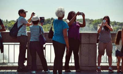 people taking pictures during daytime