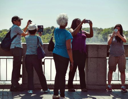 people taking pictures during daytime