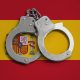 Spain flag and police handcuffs