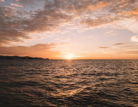 body of water during sunset