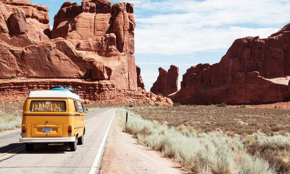 yellow Volkswagen van on road