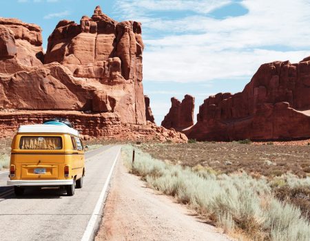 yellow Volkswagen van on road