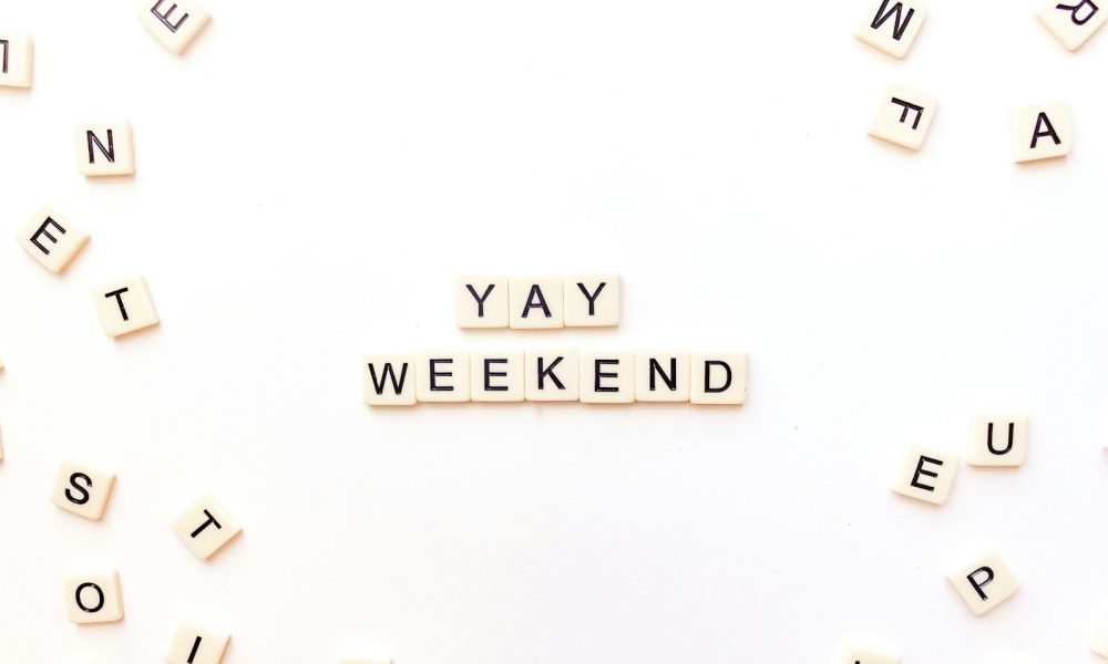 scrabble letters spelling out the word yay weekend