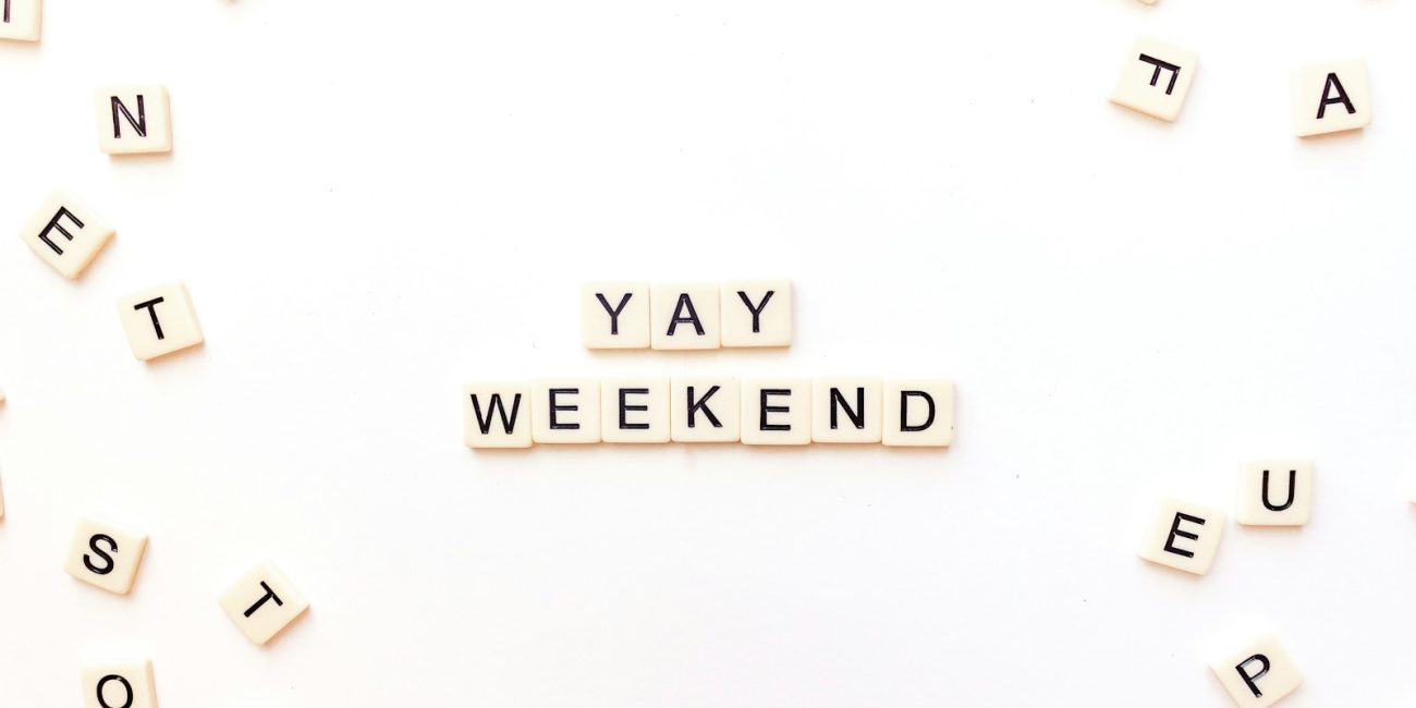 scrabble letters spelling out the word yay weekend