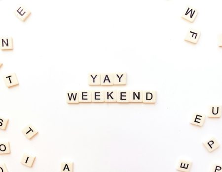 scrabble letters spelling out the word yay weekend