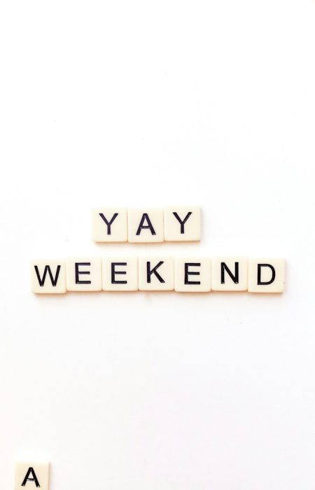 scrabble letters spelling out the word yay weekend