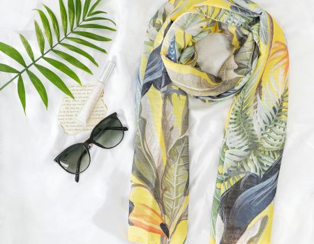 black sunglasses on yellow and white textile