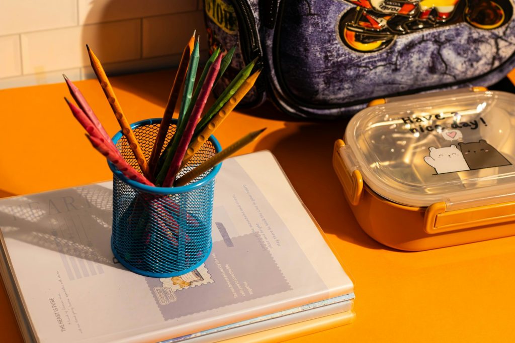 A blue backpack sitting on top of a yellow table