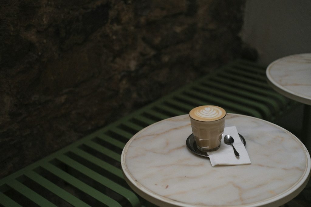 A cup of coffee sitting on top of a table