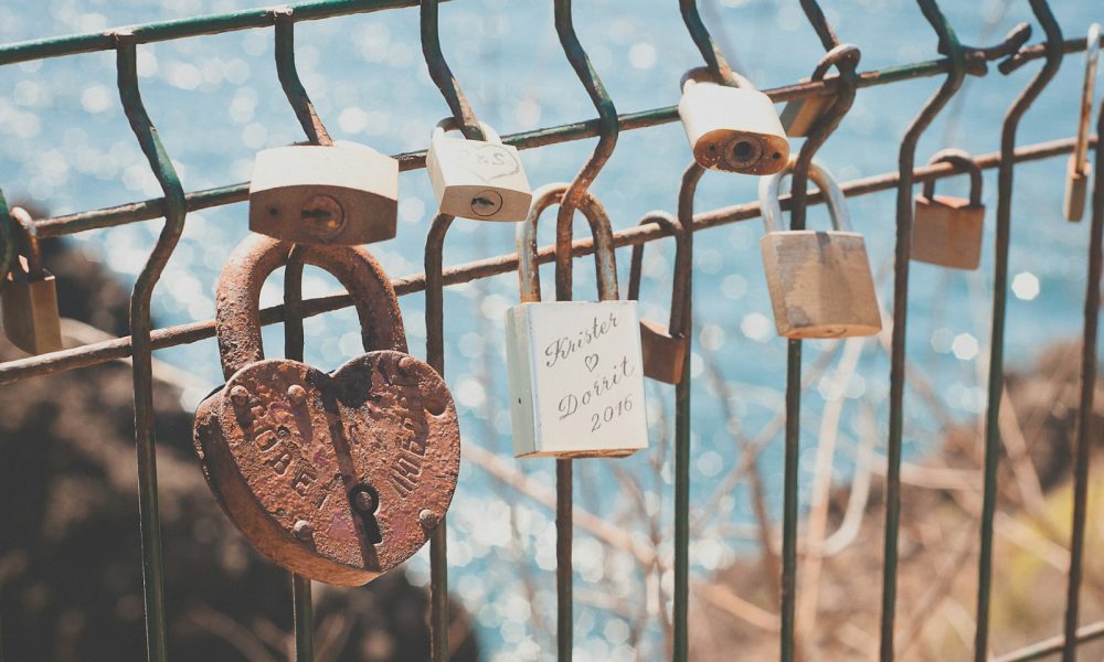 closeup photography of padlock at daytime