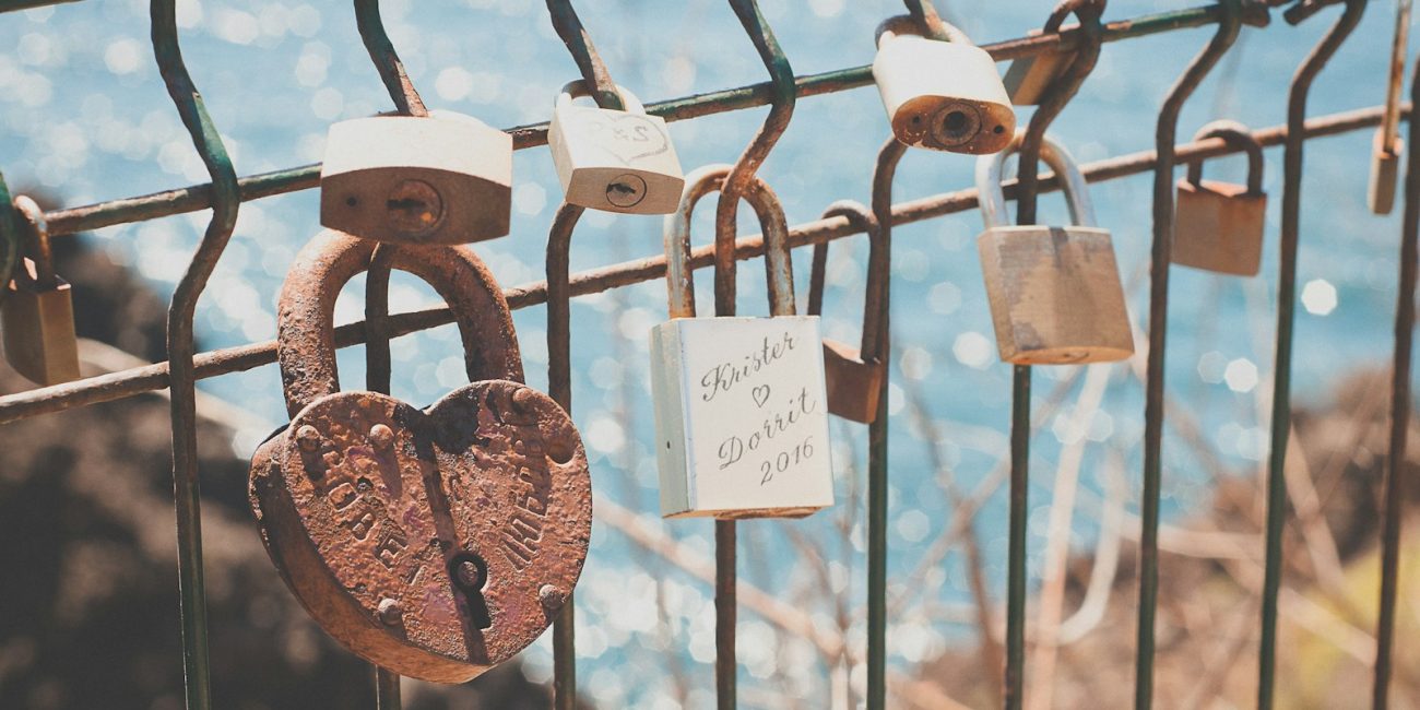closeup photography of padlock at daytime