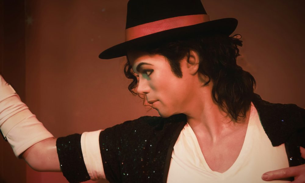 a man in a top hat and black jacket