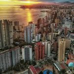 a view of a city with a body of water in the background