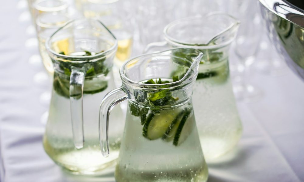 clear glass pitcher with content