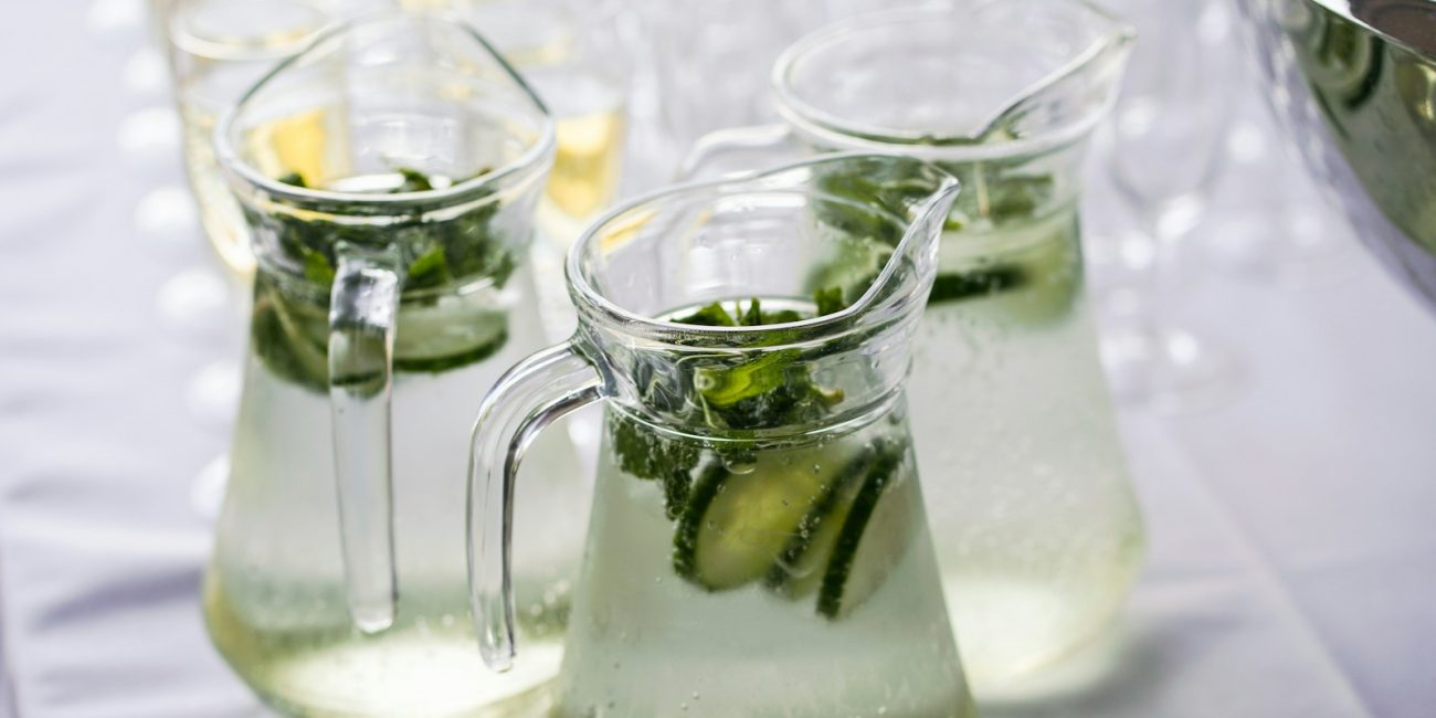 clear glass pitcher with content