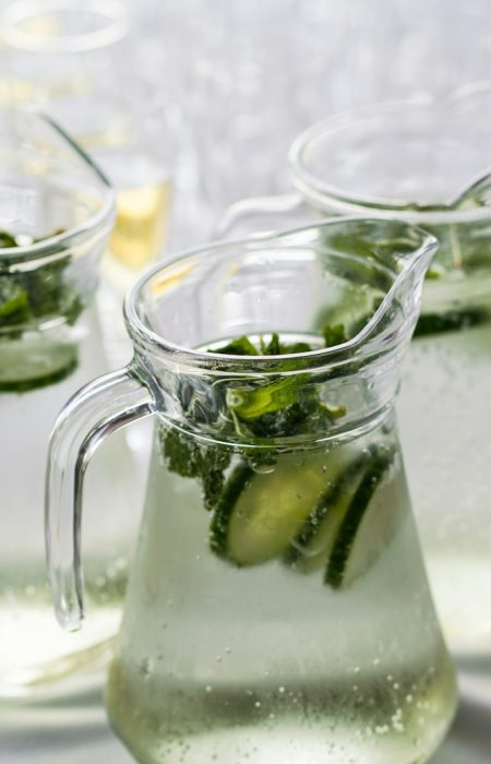 clear glass pitcher with content