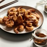 a plate of fried food on a table