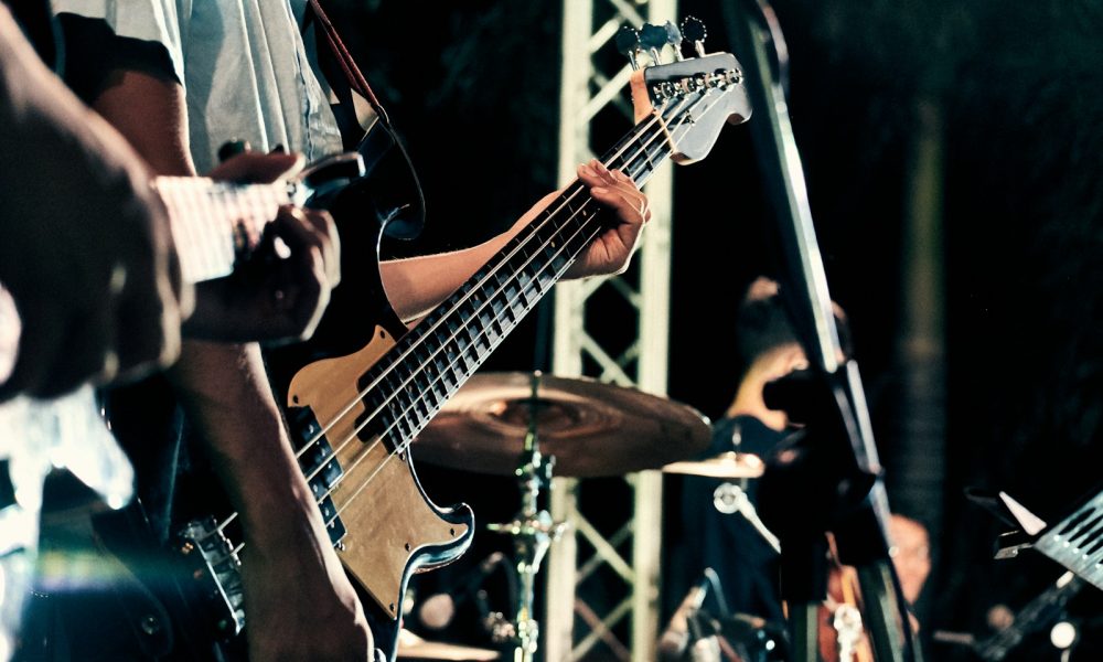 man playing guitar on stage
