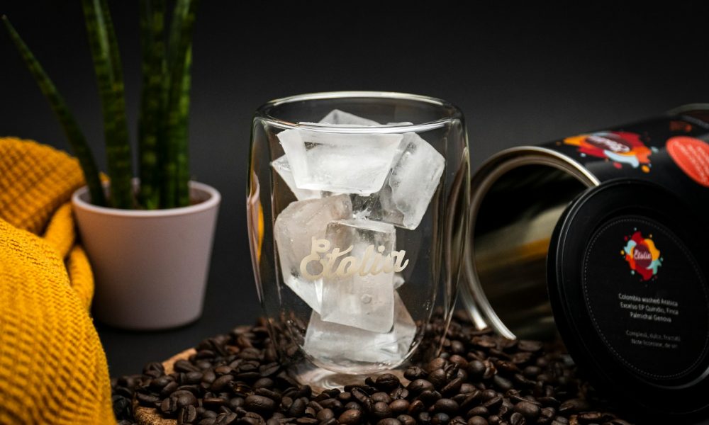 clear glass mug on coffee beans