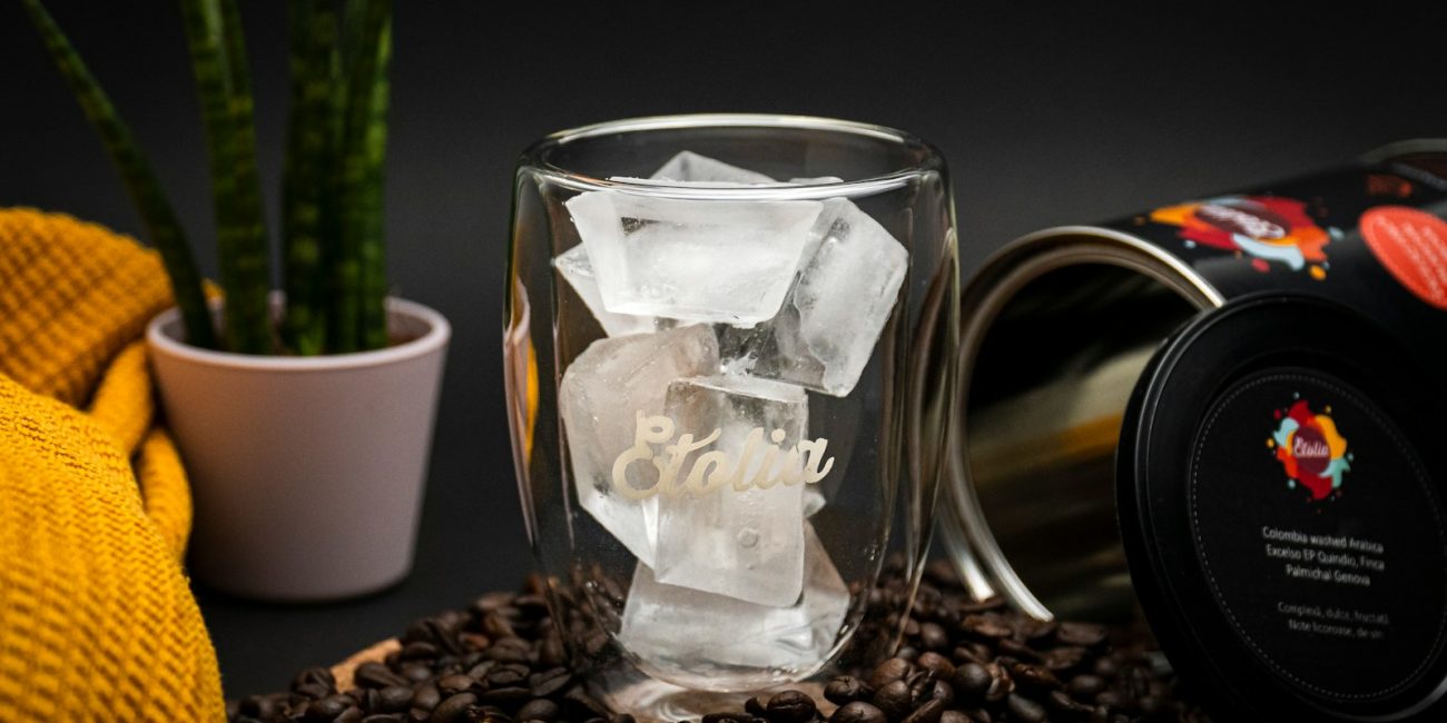 clear glass mug on coffee beans
