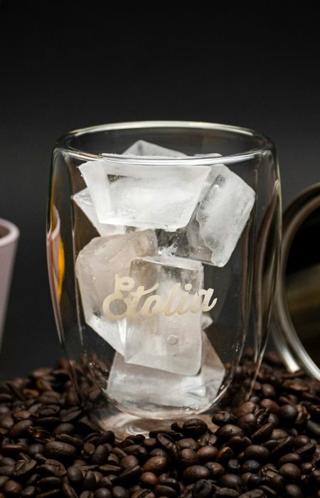 clear glass mug on coffee beans