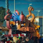 a group of people watching a parade float