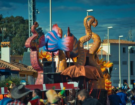 a group of people watching a parade float