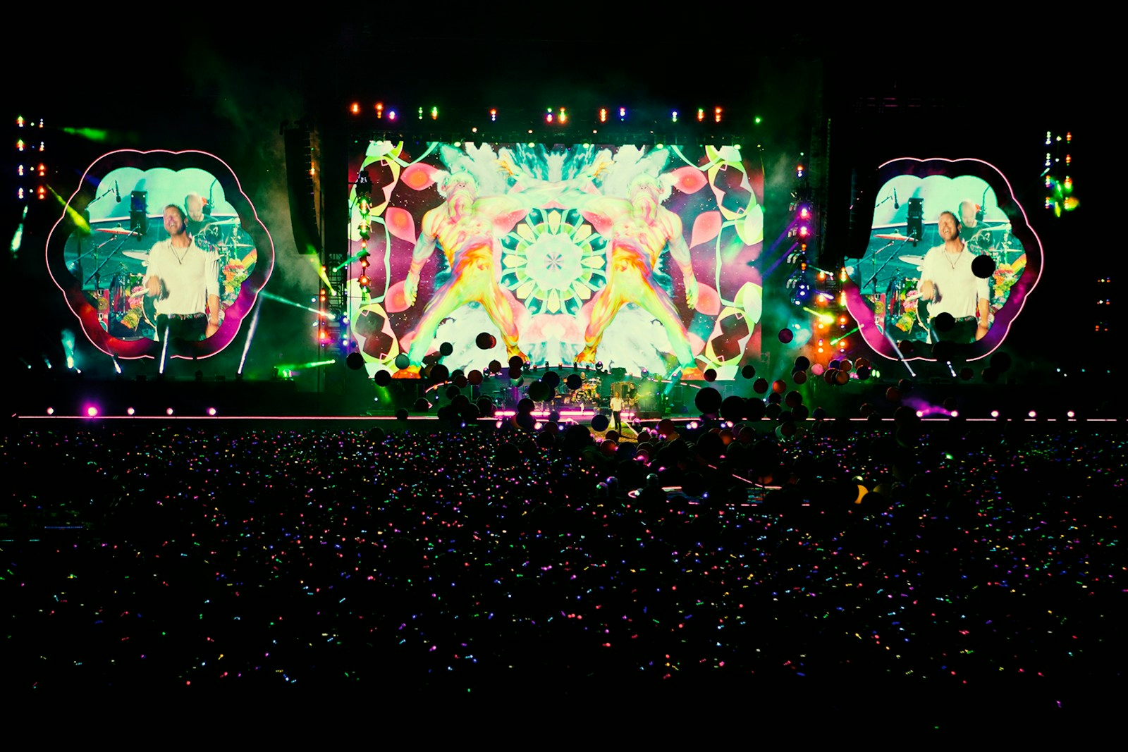 people standing in front of stage partying during nighttime