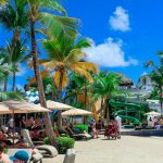 People are relaxing on a beautiful tropical beach.