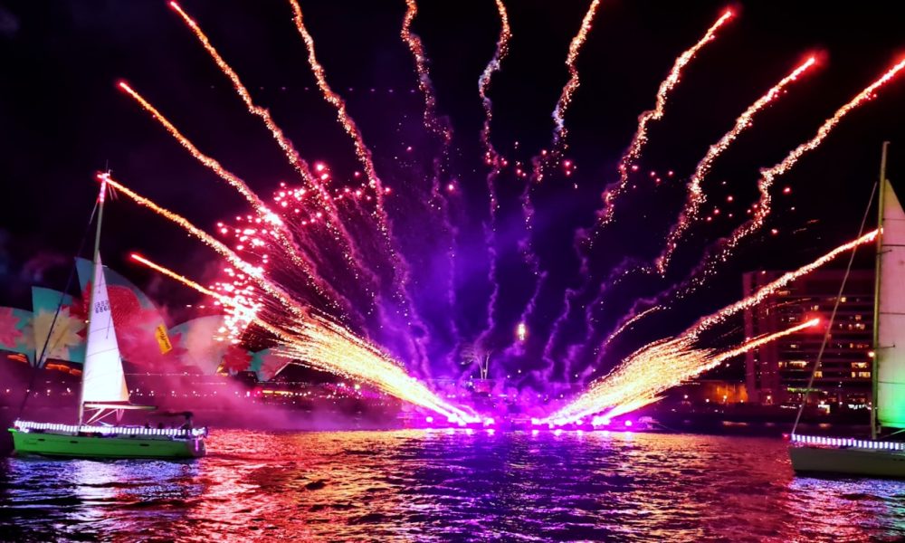 a colorful fireworks display over a body of water