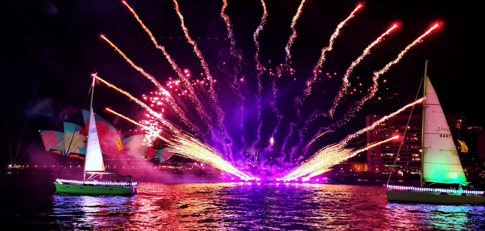 a colorful fireworks display over a body of water