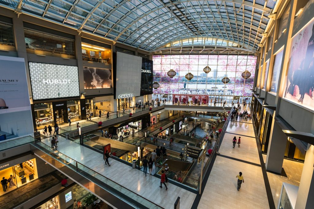a mall filled with lots of people walking around