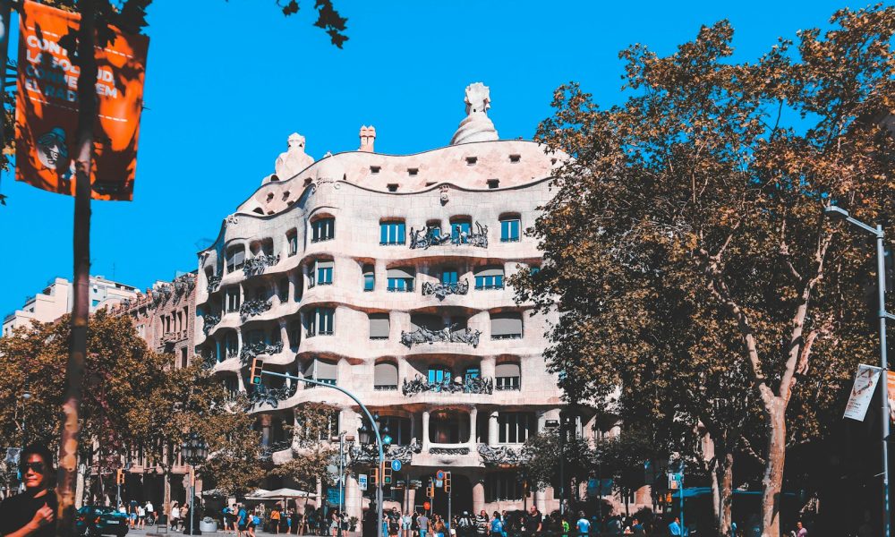 white and beige concrete building near trees