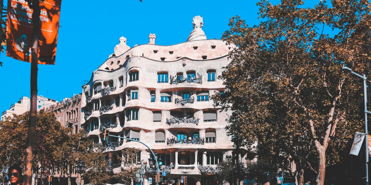 white and beige concrete building near trees