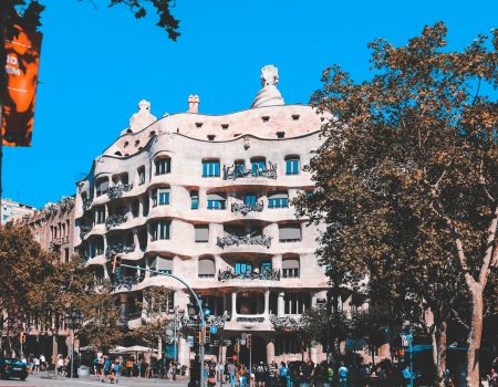 white and beige concrete building near trees