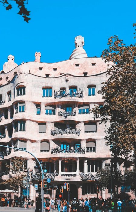 white and beige concrete building near trees