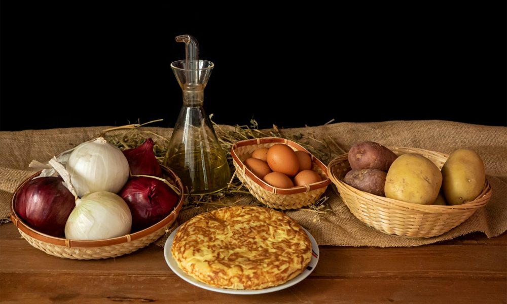 a table topped with bowls of food and a pie