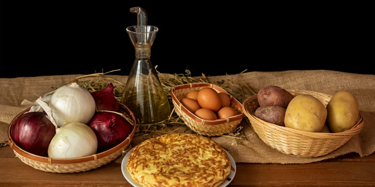 a table topped with bowls of food and a pie