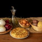 a table topped with bowls of food and a pie