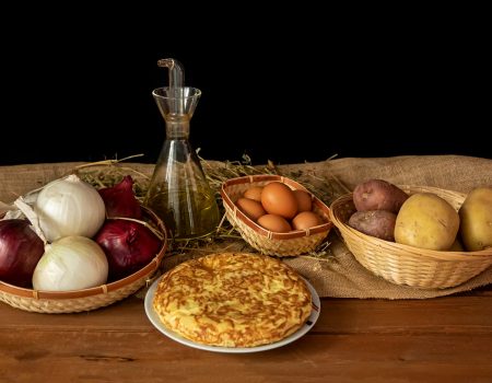 a table topped with bowls of food and a pie