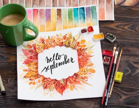 happy birthday greeting card beside green ceramic mug