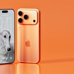 Two rose gold iphones on an orange background
