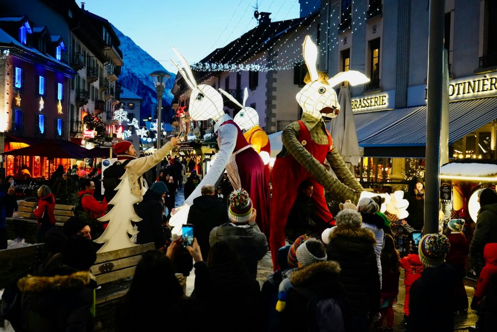a group of people in bunny costumes walking down a street