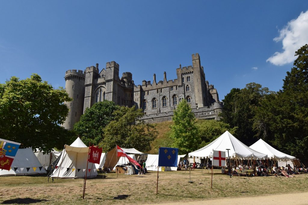 a castle with many tents in front of it
