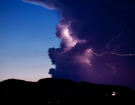 a large cloud with a lightning bolt coming out of it
