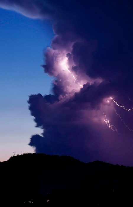 a large cloud with a lightning bolt coming out of it