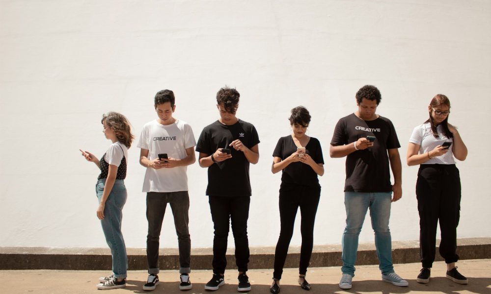 group of people standing on brown floor