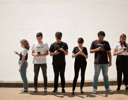 group of people standing on brown floor
