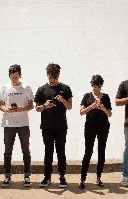 group of people standing on brown floor