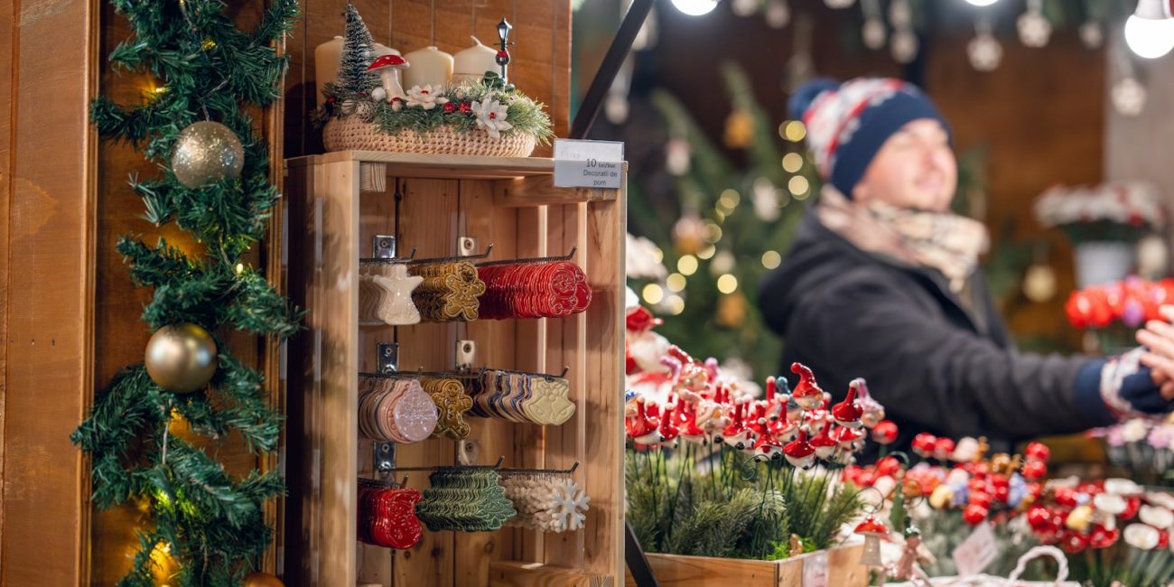 a woman standing in front of a christmas display